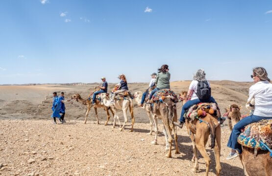 Caravan of tourists start out on camel ride across Agafay Desert