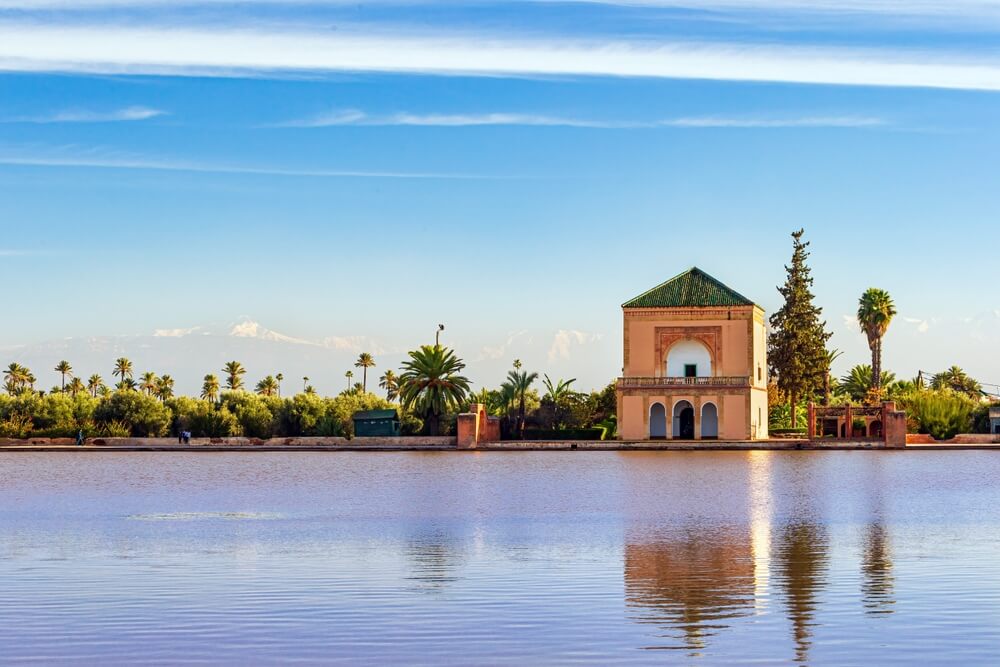 Saadian Pavillon at Menara gardens with Atlas mountains in Marrakech